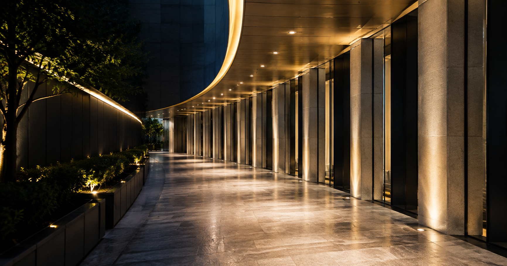 Illuminated modern architectural pathway with repeating columns and a curving route forward, representing disciplined progression through the TQ Method.
