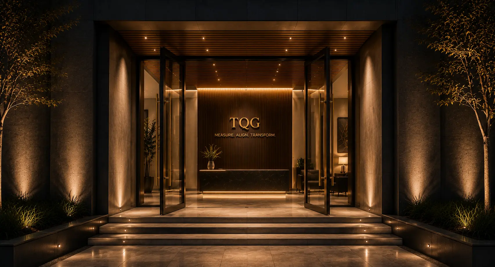 A premium contemporary entrance at night with open glass doors, warm architectural lighting, landscaped steps, and a refined reception interior.